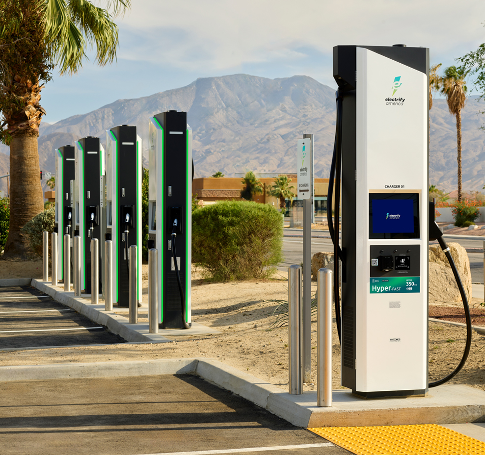 Closeup of a person fueling an electric vehicle.