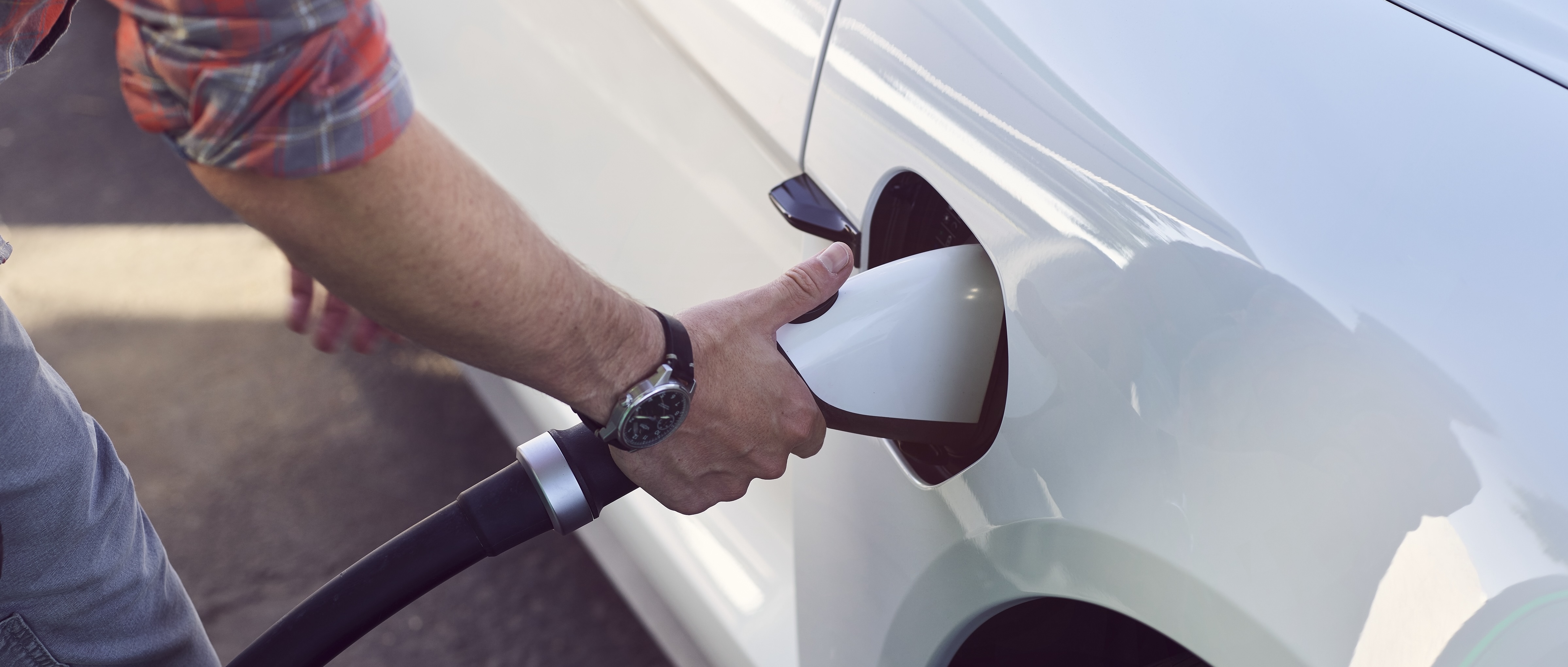 Plugging in an electric vehicle charging connector